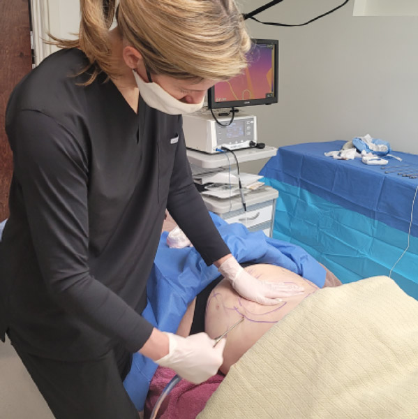 dr performing liposuction at Charlotte Skin & Laser